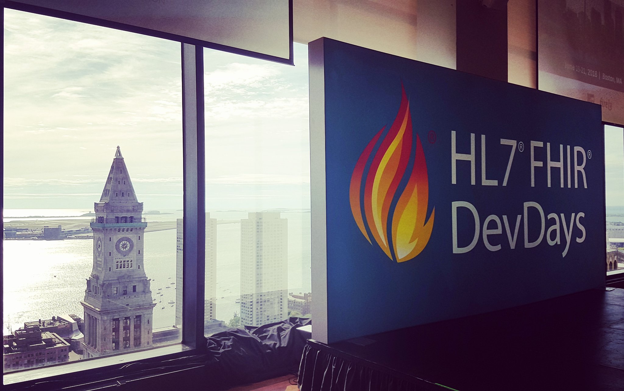 FHIR DevDays sign with Boston backdrop-1